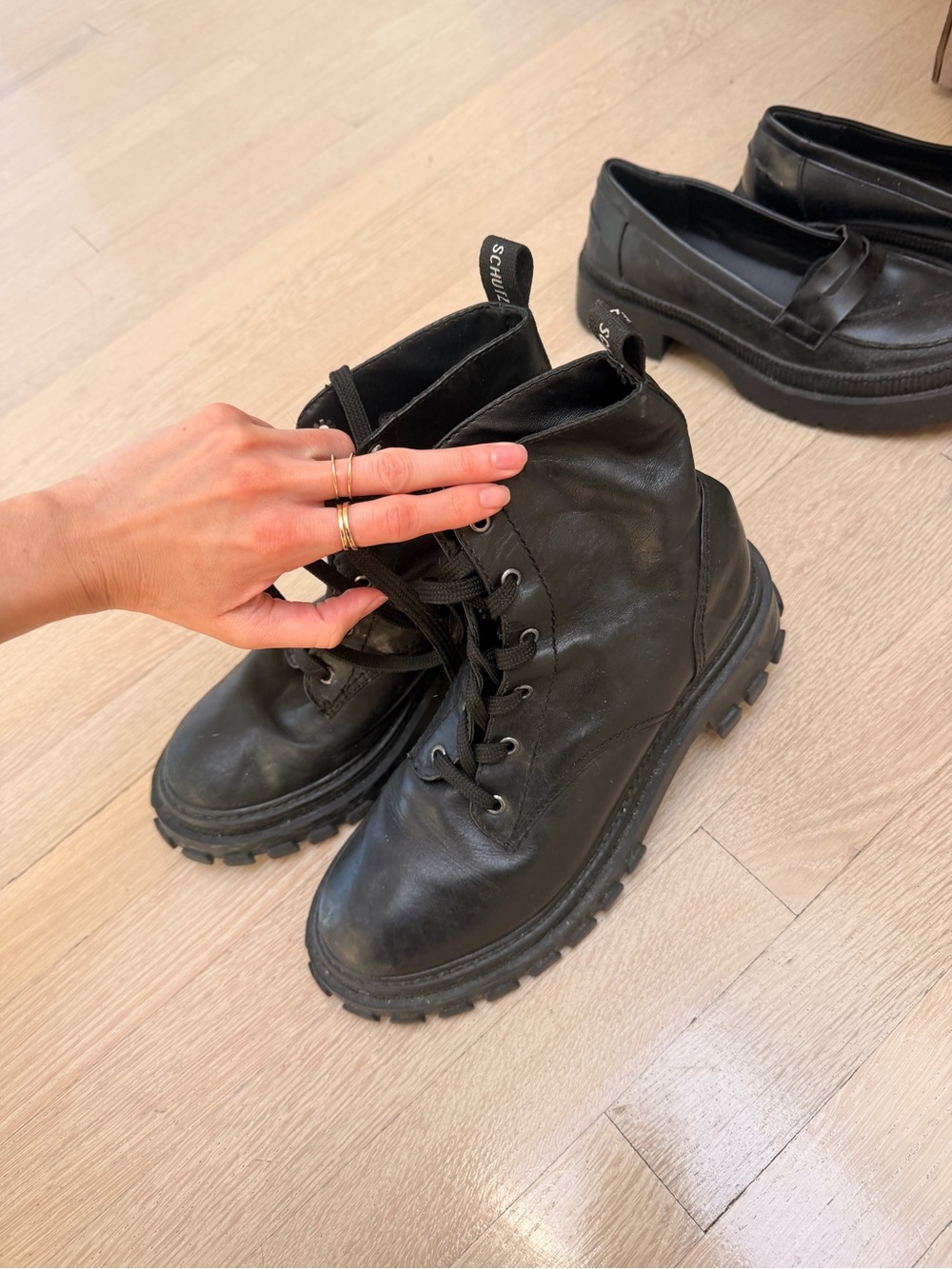SCHUTZ Black Leather Lug Sole Ankle Boots
